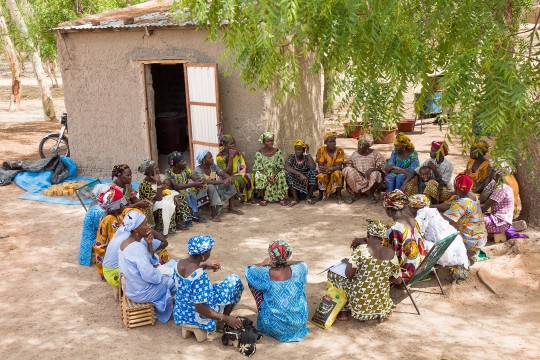 malian women sitting in circle