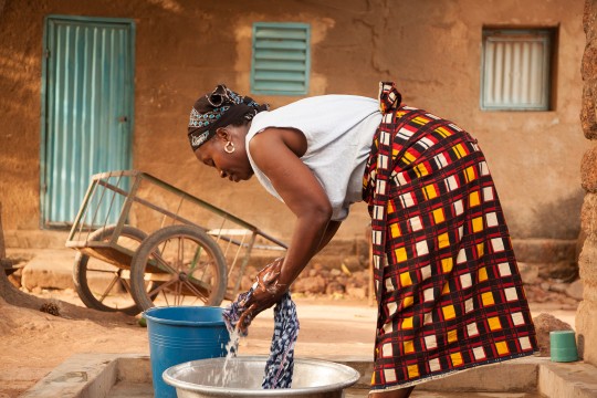 Woman doing laundry in burkina faso