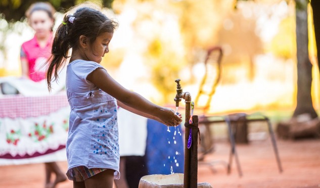 Little girl washing her hands