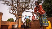 Woman pumping water in Burkina Faso