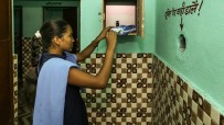 young indian woman taking a sanitary pad