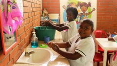 girls washing their hands