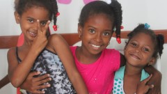 smiling little girls posing for the camera